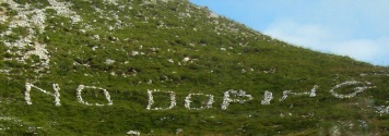 NO DOPING scritto con le pietre su una montagna perch entri nei cuori e nelle coscenze